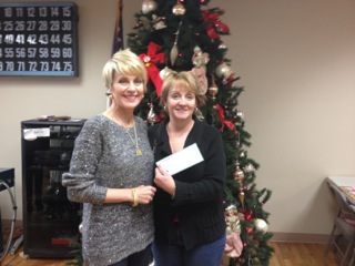 Board Member Mary Higuchi presenting a grant check to Mid-City Concerns, Meals on Wheels Spokane, WA